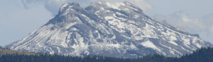 A distant mountain range with snow on it.